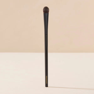 Brush Me Blending Multi Eye Brush No. 134 by Lenoites, featuring a sleek black handle with a soft, rounded brush head, displayed against a soft beige background.