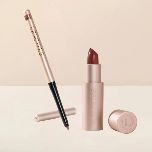 Sculpt and Hydrate Lip Duo by Lenoites featuring a Tinted Lip Balm in color midnight, a Shape & Sculpt Lip Liner in color blush, elegantly arranged on a light beige background.