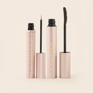 Lash Duo by Lenoites featuring a rosegold Eyelash Growth Serum with a fine applicator and a brown PowerLash Growth Serum Mascara with a two sided brush, displayed on a soft beige background.