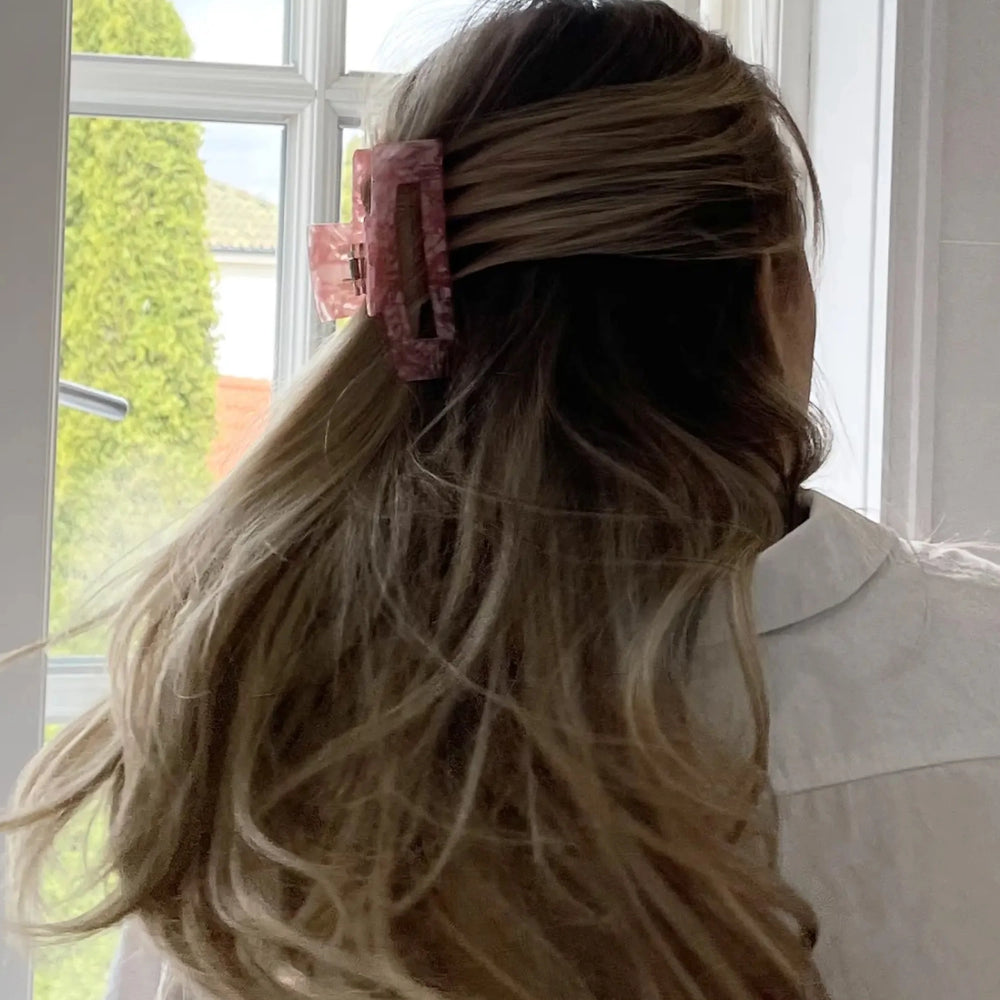 Eco-friendly Hair Claw Medium in Champagne Pearl by Lenoites, featuring the brand logo in gold, displayed against a soft beige background.