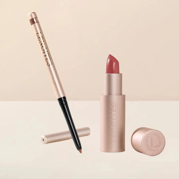 Sculpt and Hydrate Lip Duo by Lenoites featuring a Tinted Lip Balm in color berry, a Shape & Sculpt Lip Liner in color mocha, elegantly arranged on a light beige background.