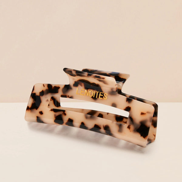 Eco-friendly Hair Claw Medium in Nude Leopard by Lenoites, featuring the brand logo in gold, displayed against a soft beige background.